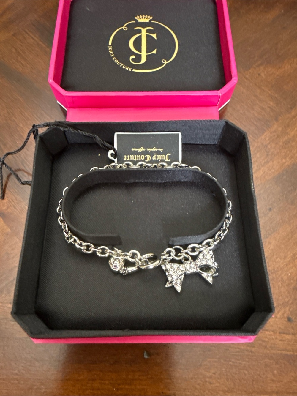 Juicy Couture Silver Tone Bow Charm Bracelet with Crystal Accents